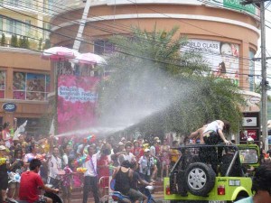 Water spraying on a crowd in Patong, Phuket 5 minutes from Patong Language School