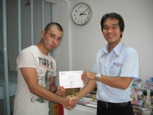 Ricardo and Boyd shake hands at Patong Language School