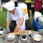 A vendor makes A Pong, a traditional local dessert