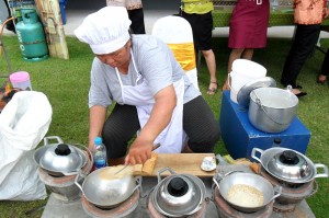 A vendor makes A Pong, a traditional local dessert